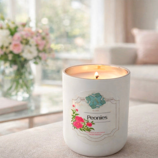 Peonies scented soy candle in a white and gold vessel by A Candle Collection